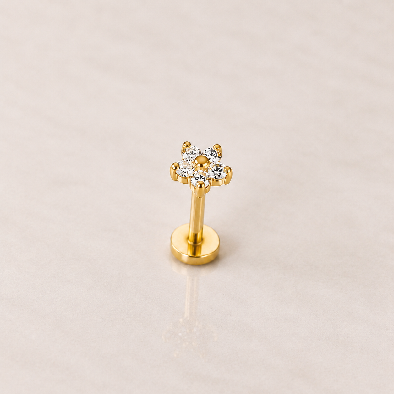 Labret acier doré avec fleur de six zircons blancs sertis à griffes et disque plat, tige 1,2 × 8 mm
