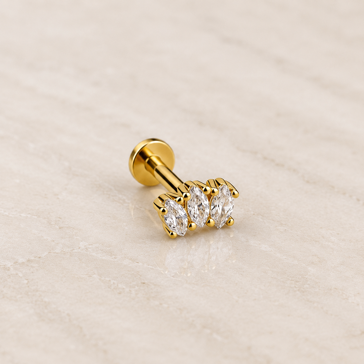 Labret acier doré avec trois zircons blancs taille marquise sertis griffes, tige 1,2 x 8 mm
