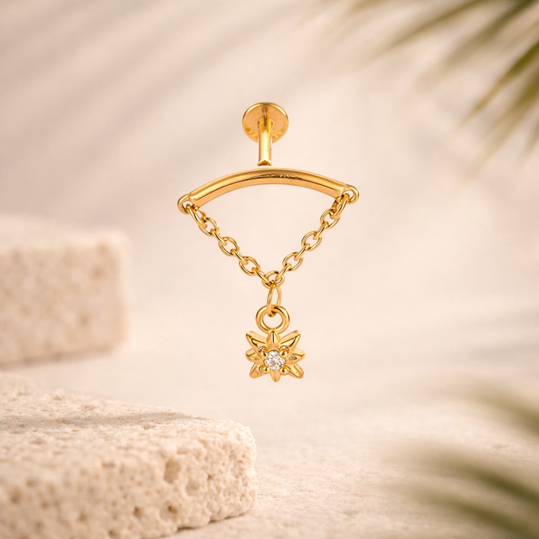 Labret doré en acier avec barre incurvée, chaînette fine et pendentif étoile serti d'un zircon blanc