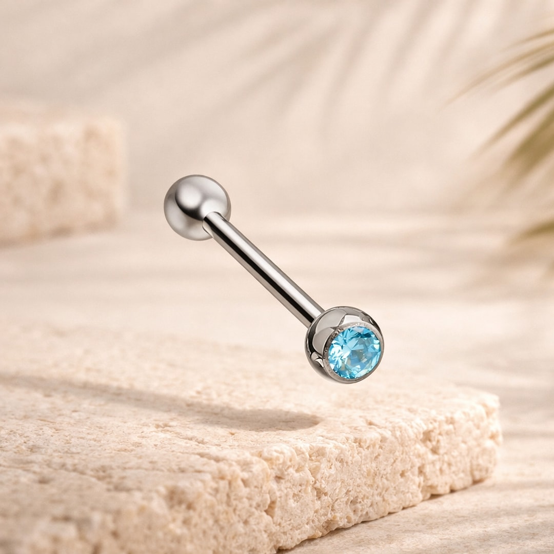Barre de piercing langue en titane argenté avec bille lisse et zircon rond bleu serti