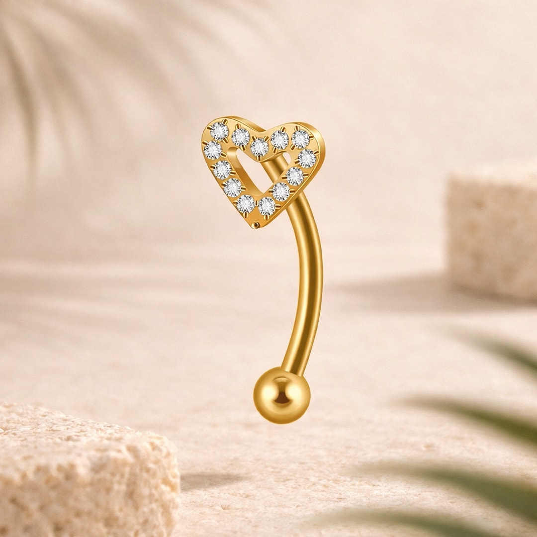 Banane de nombril en titane doré avec cœur ajouré pavé de zircons blancs et bille lisse