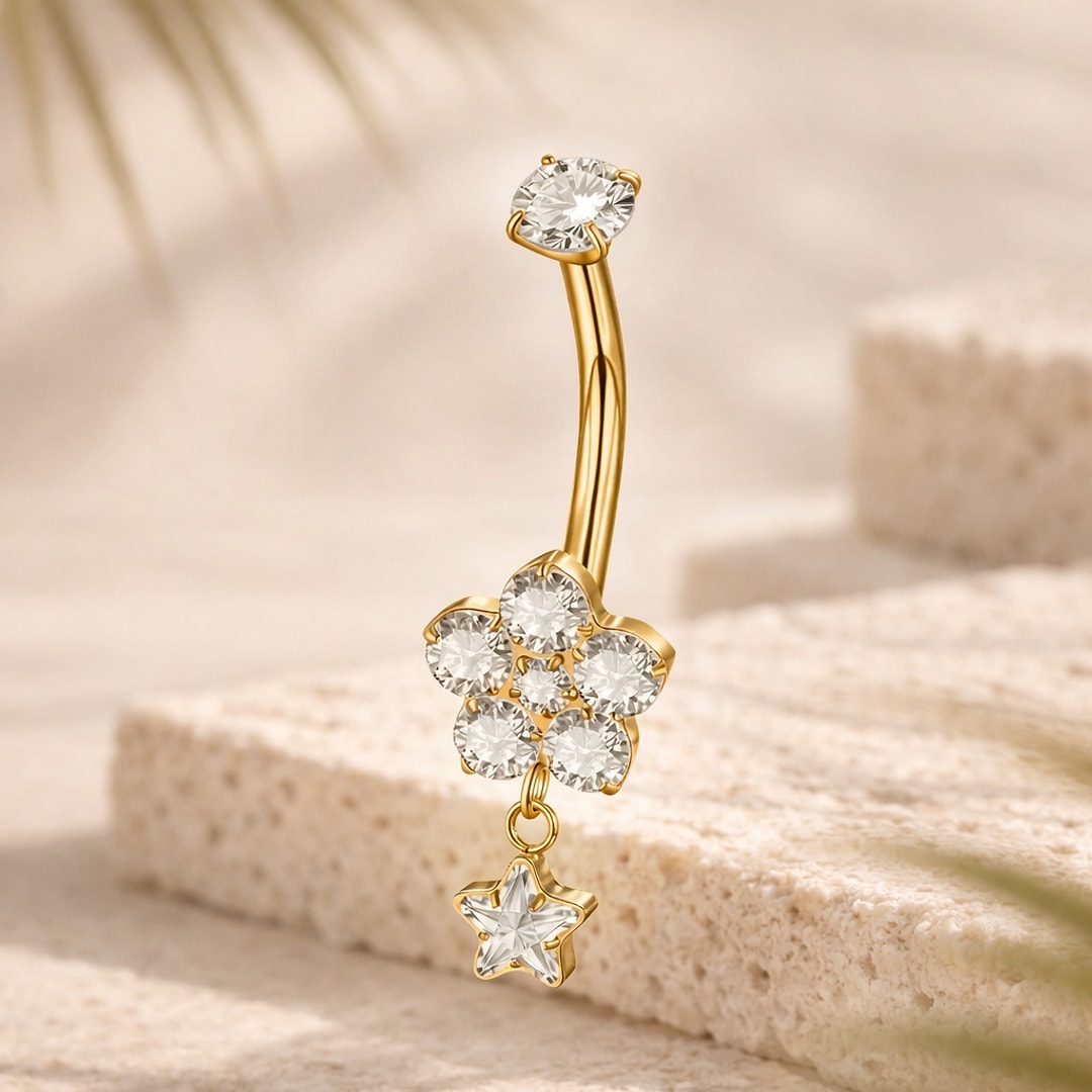 Banane de nombril en titane doré avec fleur de zircons blancs et étoile pendante facettée