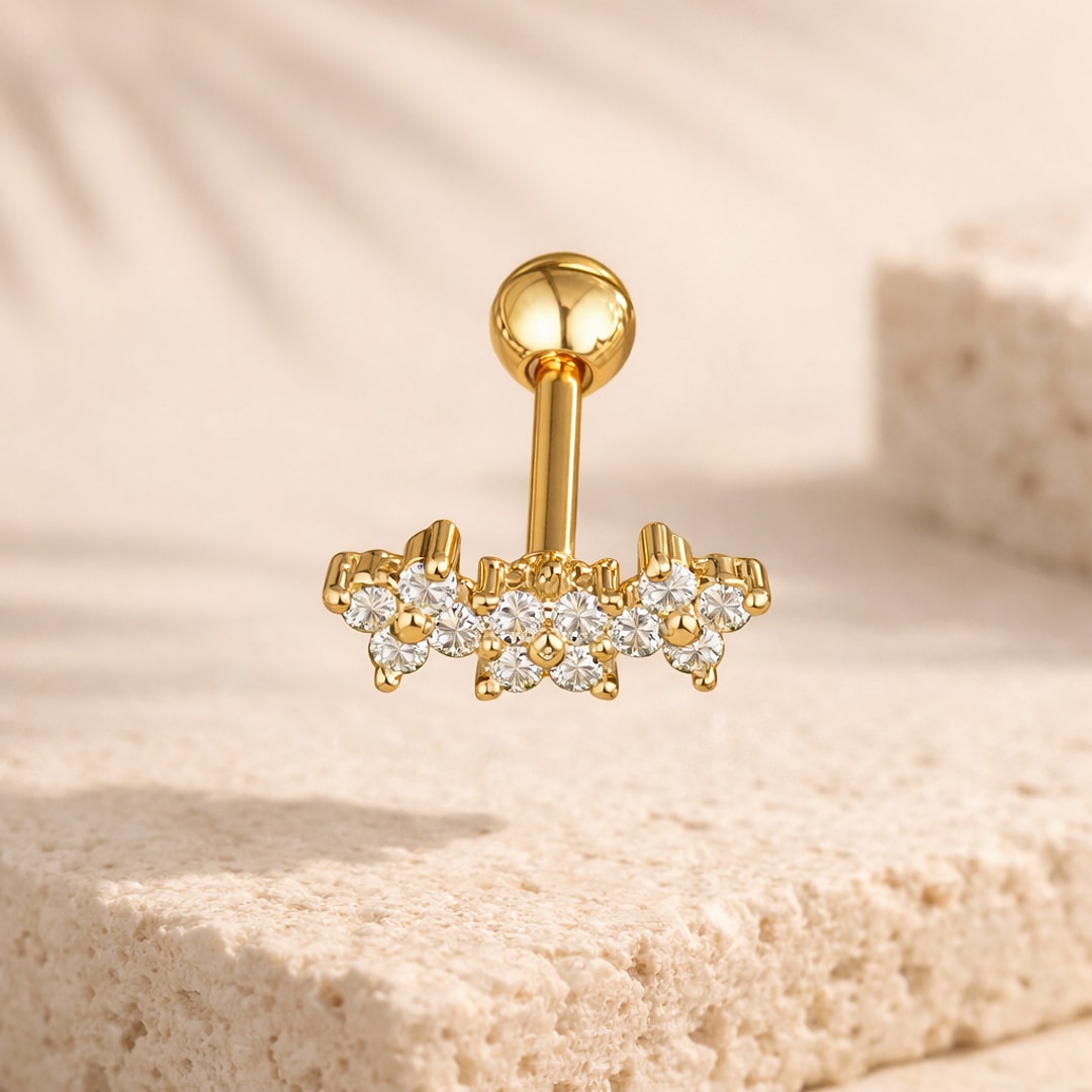Stud cartilage doré en acier avec barrette de zircons blancs sertis et bille vissée