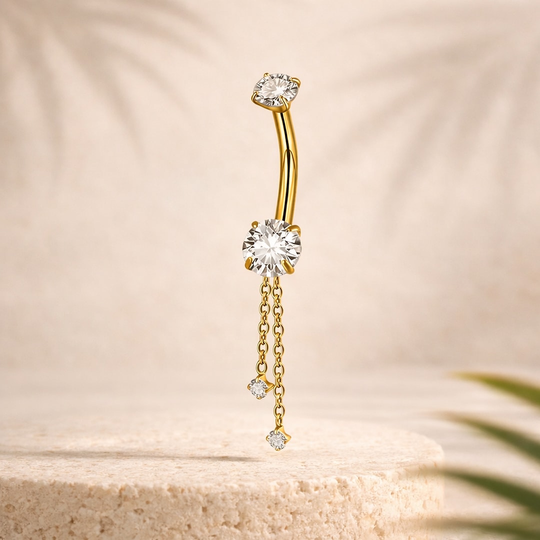 Banane de nombril en titane doré avec zircons ronds et deux chaînes pendantes serties de petites pierres