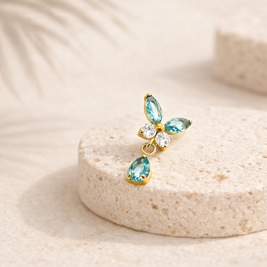 Top papillon en titane doré, zircons turquoise marquise et blancs, pendant goutte turquoise