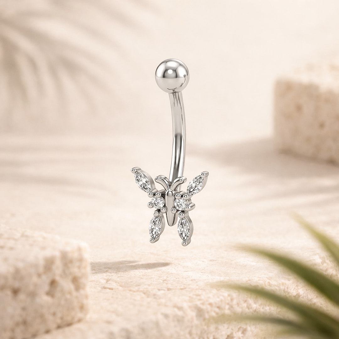 Piercing nombril acier argenté avec papillon serti de pierres marquises blanches, bille lisse en haut