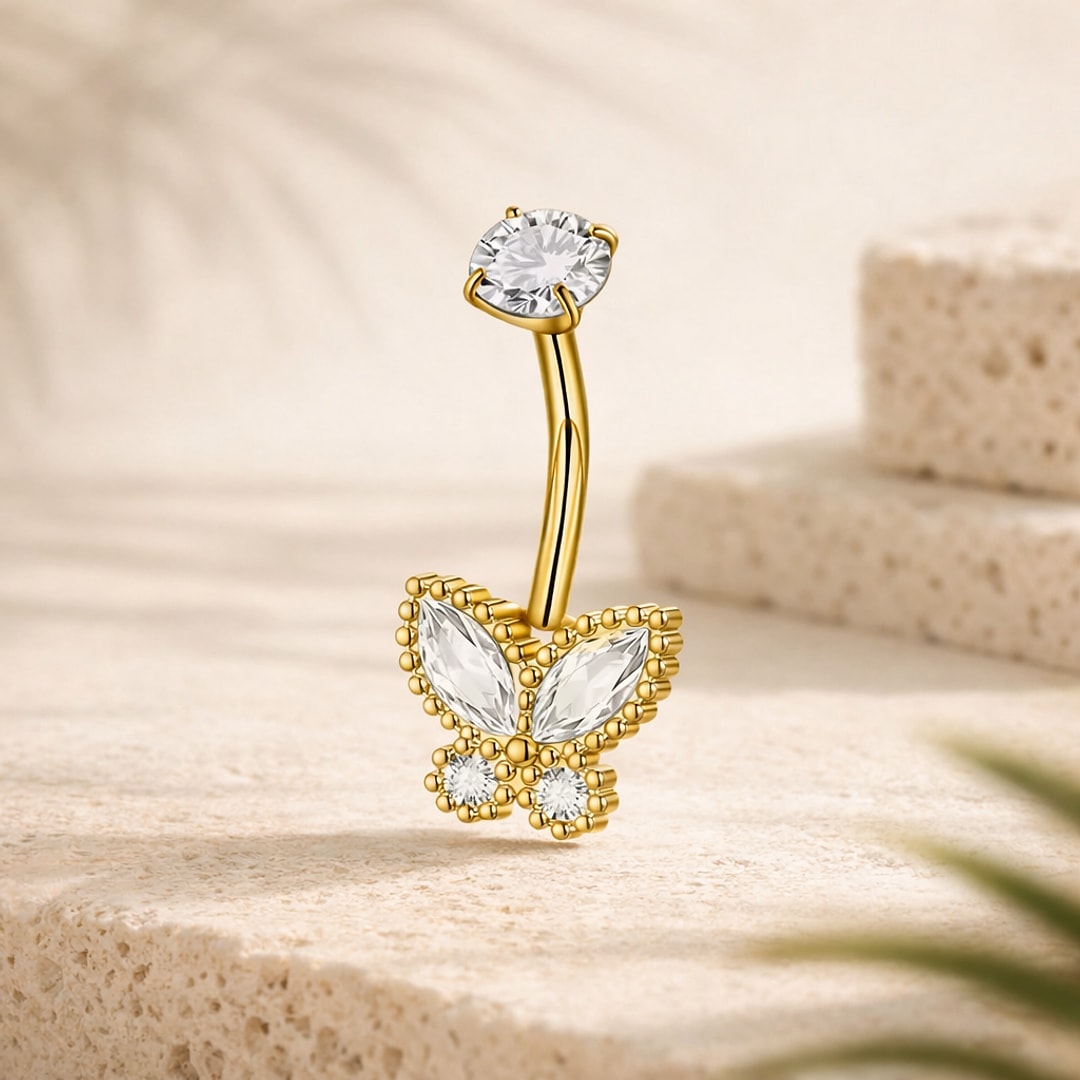 Piercing nombril acier doré avec papillon en cristaux blancs et pierre ronde sur la tige