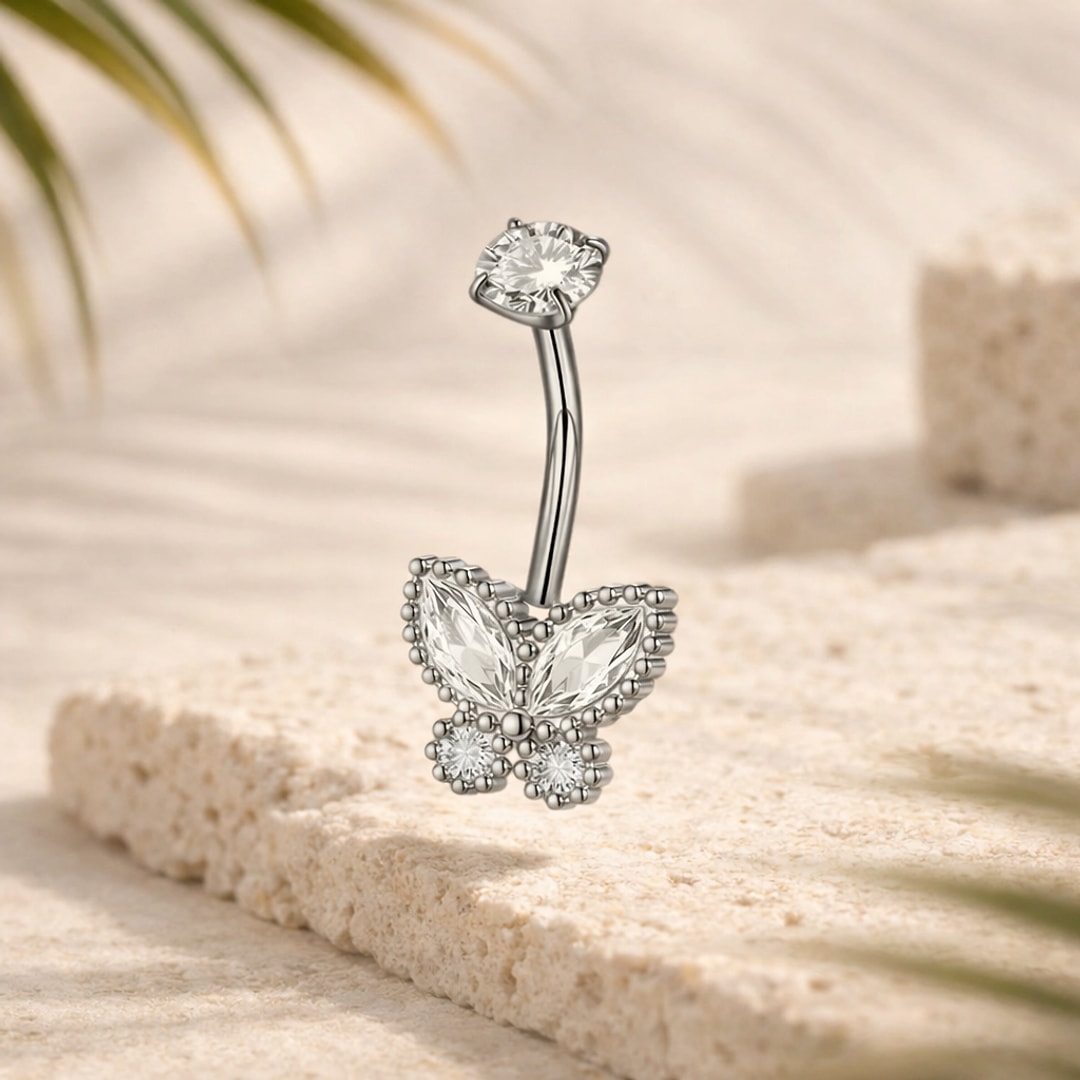 Piercing nombril acier argenté avec papillon en cristaux blancs et pierre ronde sur la tige