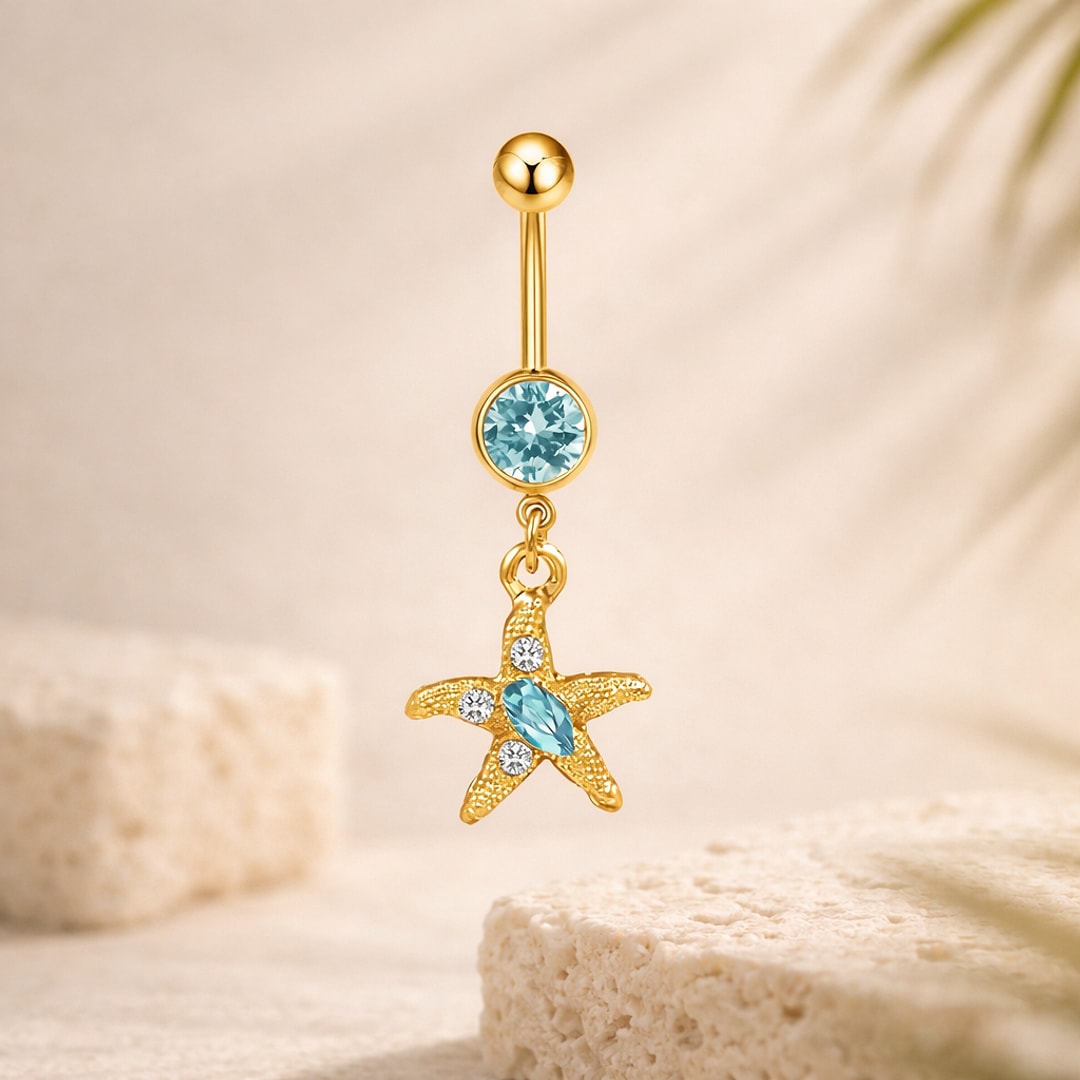 Banane de nombril dorée avec pierre bleue et pendentif étoile de mer serti de cristaux blancs