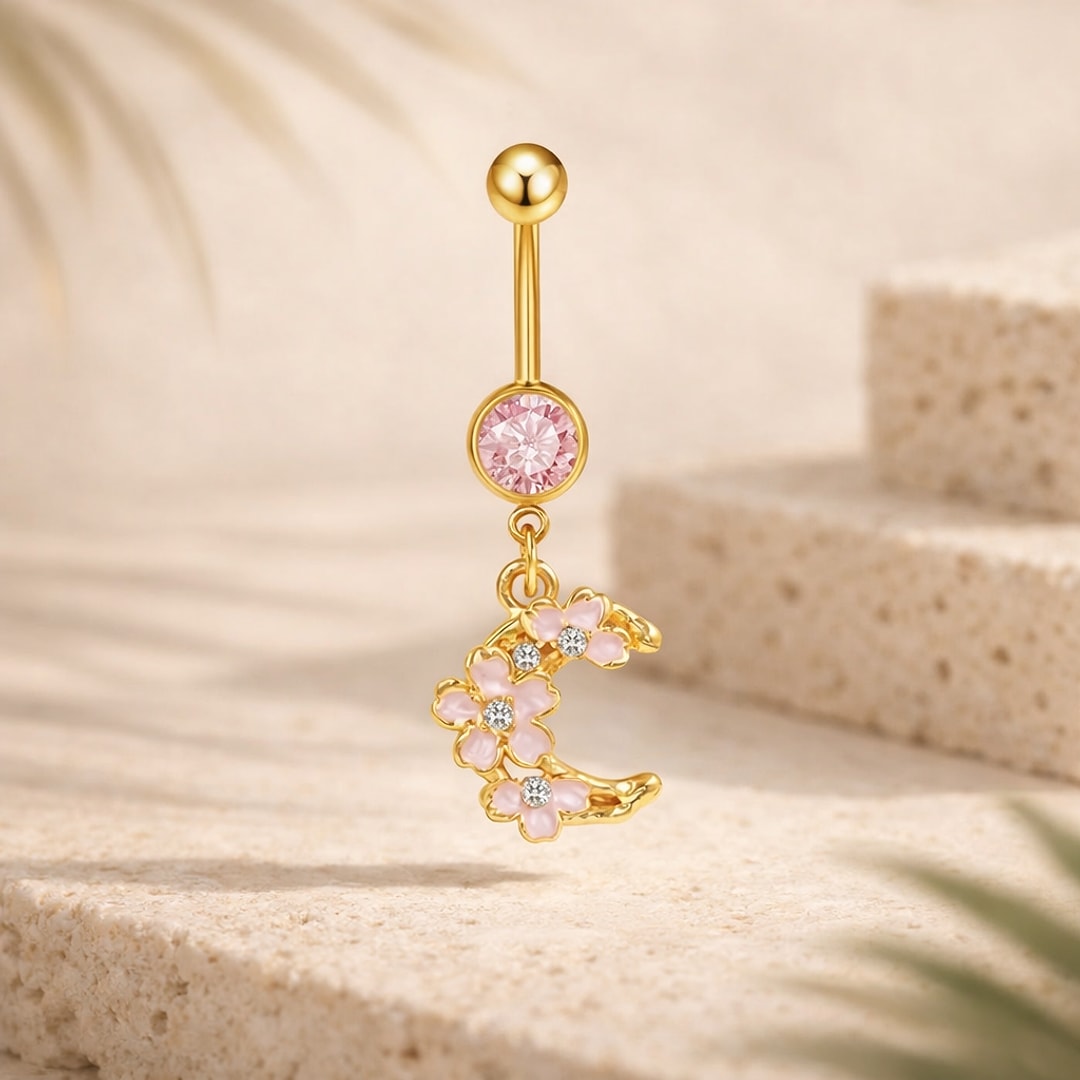 Banane de nombril dorée avec pierre rose et pendentif lune orné de fleurs roses et cristaux