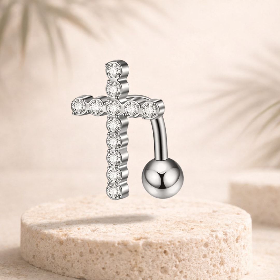 Banane de nombril en acier argenté avec motif croix pavé de zircons blancs et bille polie