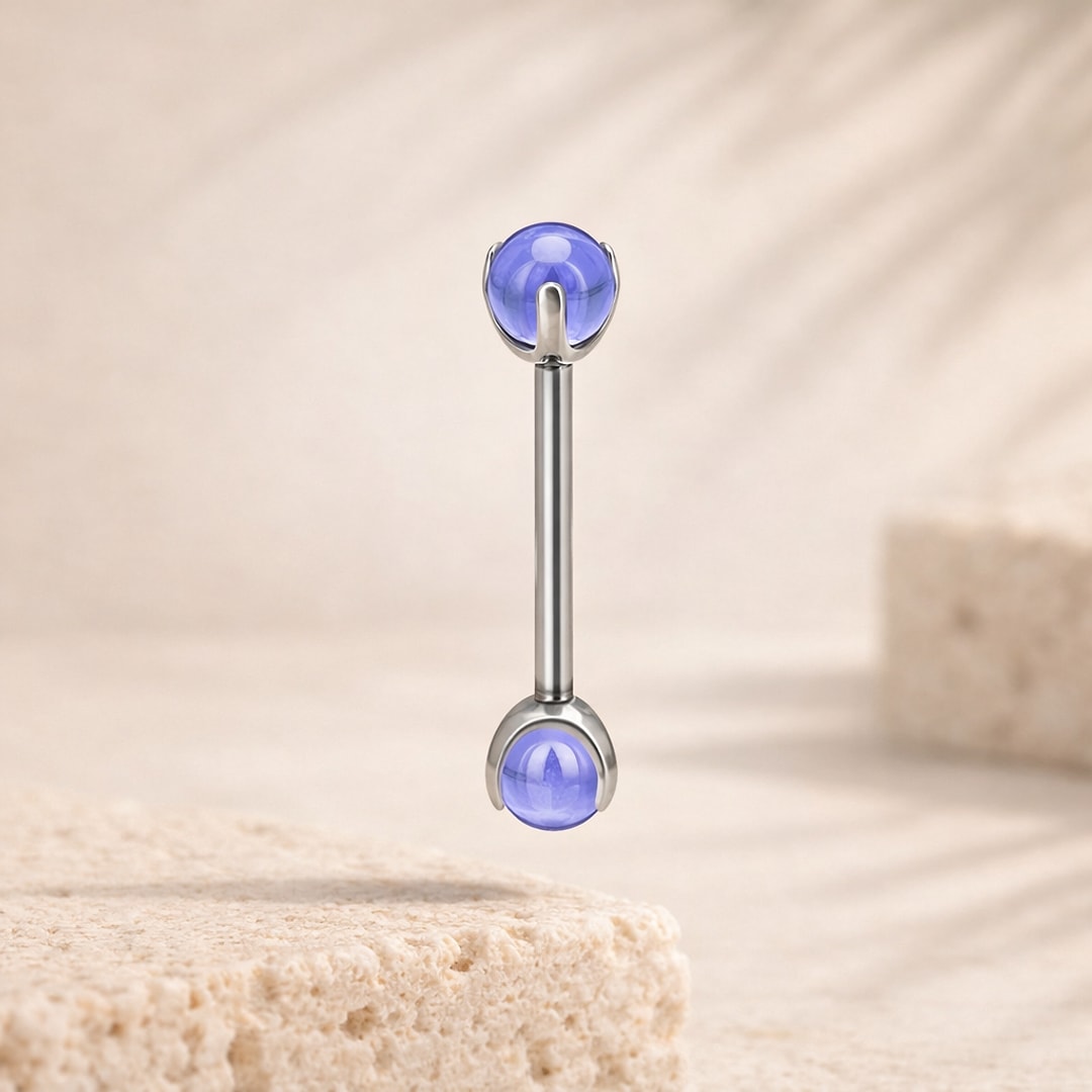 Barre de piercing de langue en titane argenté avec deux zircons bleus ronds sertis griffes