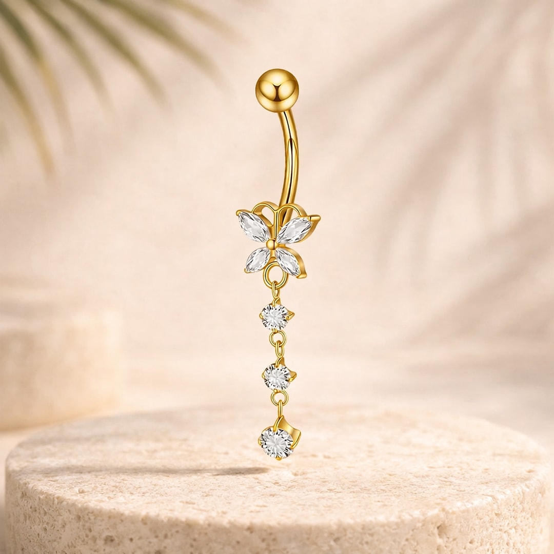 Banane de nombril en titane doré avec papillon en zircons blancs et pendant de trois pierres rondes