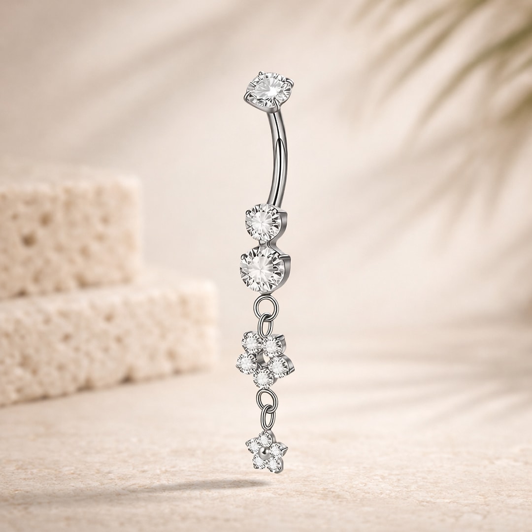 Banane de nombril en titane argenté avec zircons ronds et pendentif à deux fleurs serties de strass