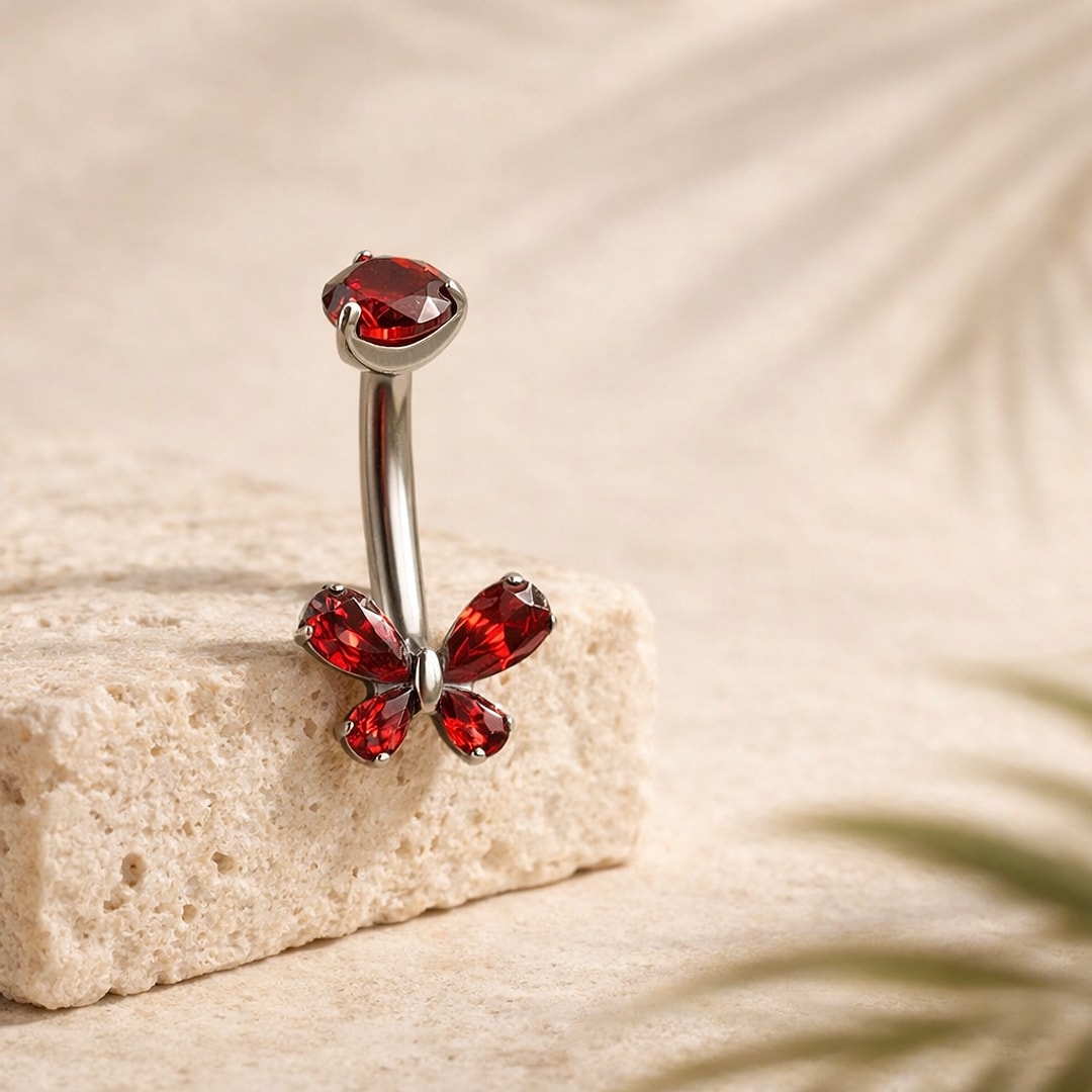Banane de nombril en titane argenté avec zircon rouge rond et papillon serti de zircons rouges en forme de goutte