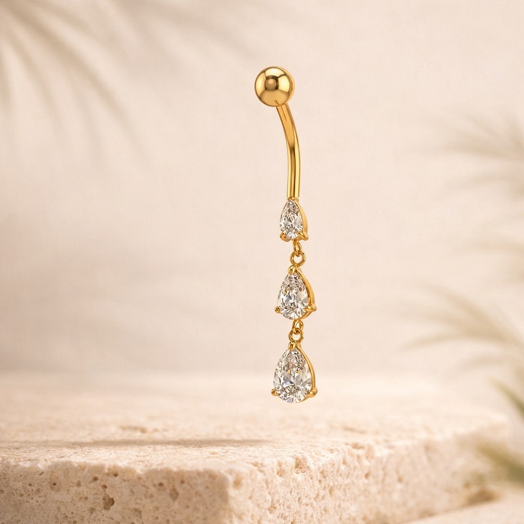 Banane de nombril dorée en acier avec trois zircons blancs en forme de goutte pendants