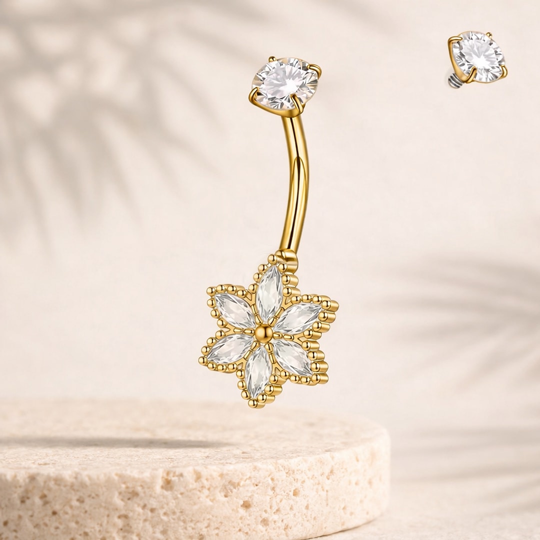 Banane de nombril dorée avec fleur en zircons blancs taille navette et pierre ronde en haut de tige
